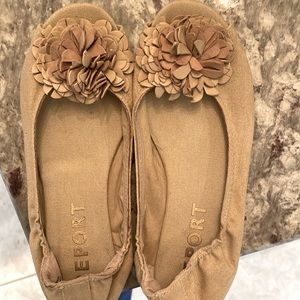 Adorable peek toe light tan canvas shoe.